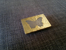 Nickel butterfly brass badge